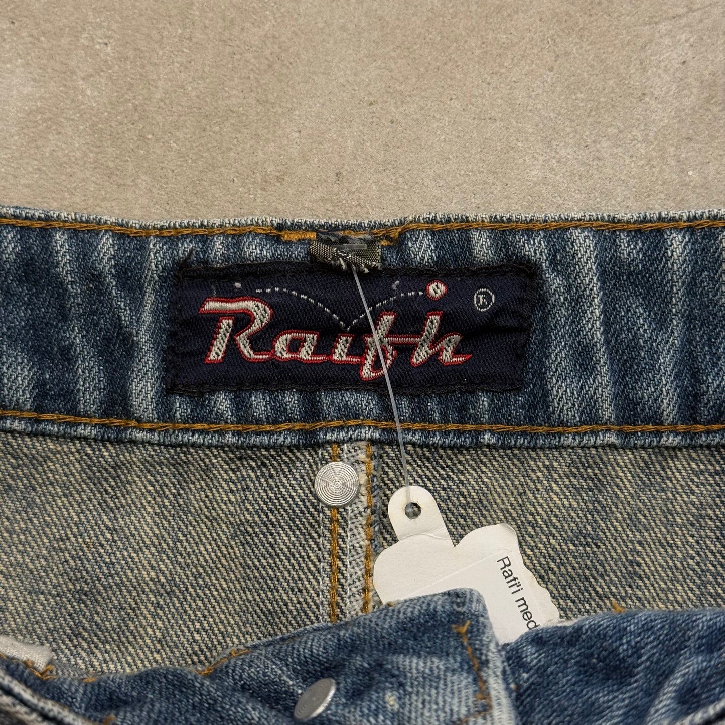 Rafi'i medium wash stud mini skirt